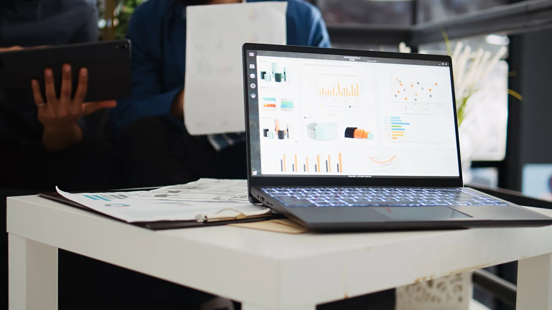 Two people reviewing analytics together on a laptop